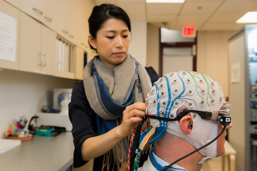 scientist adjusting cap