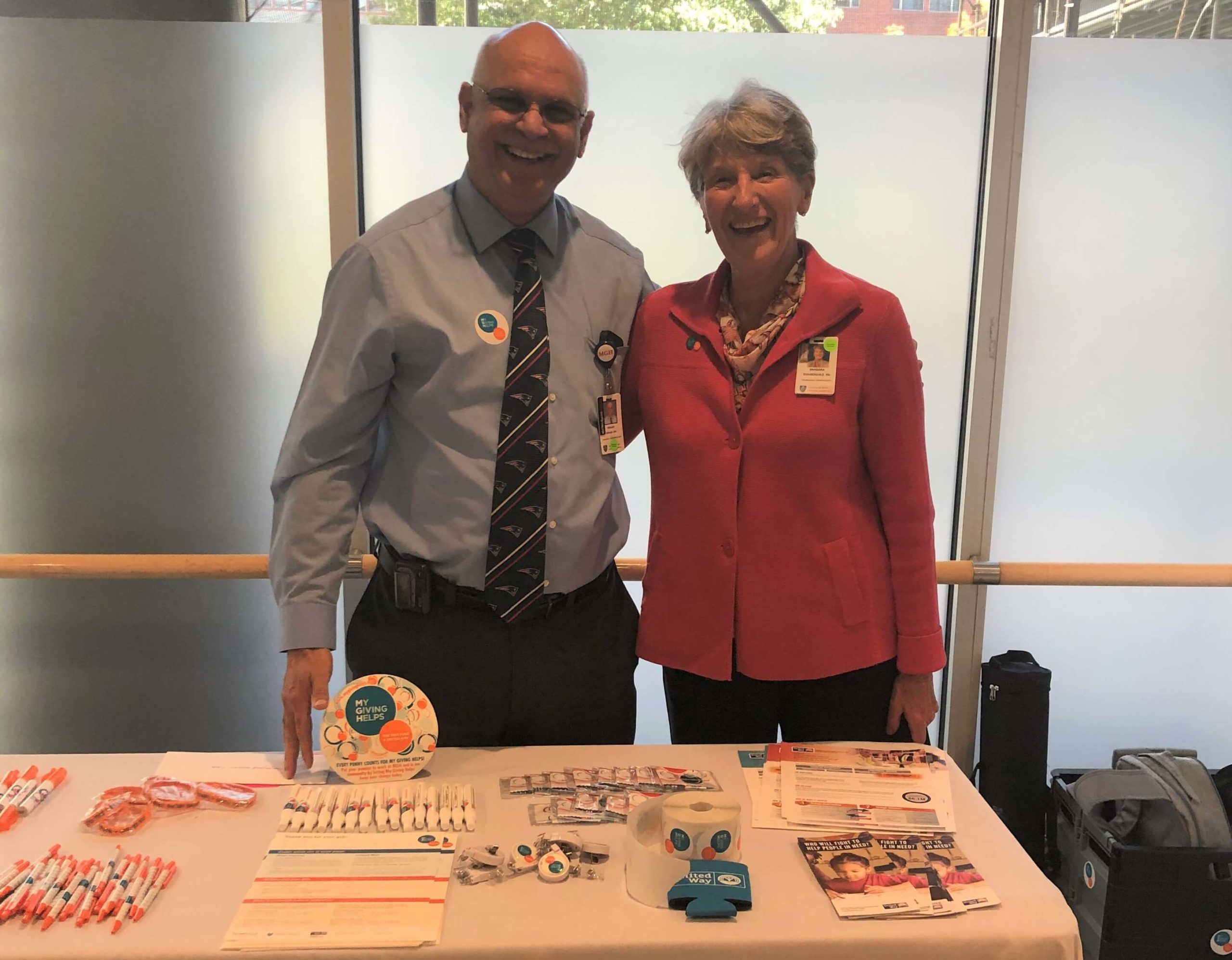 Champions volunteers at a table