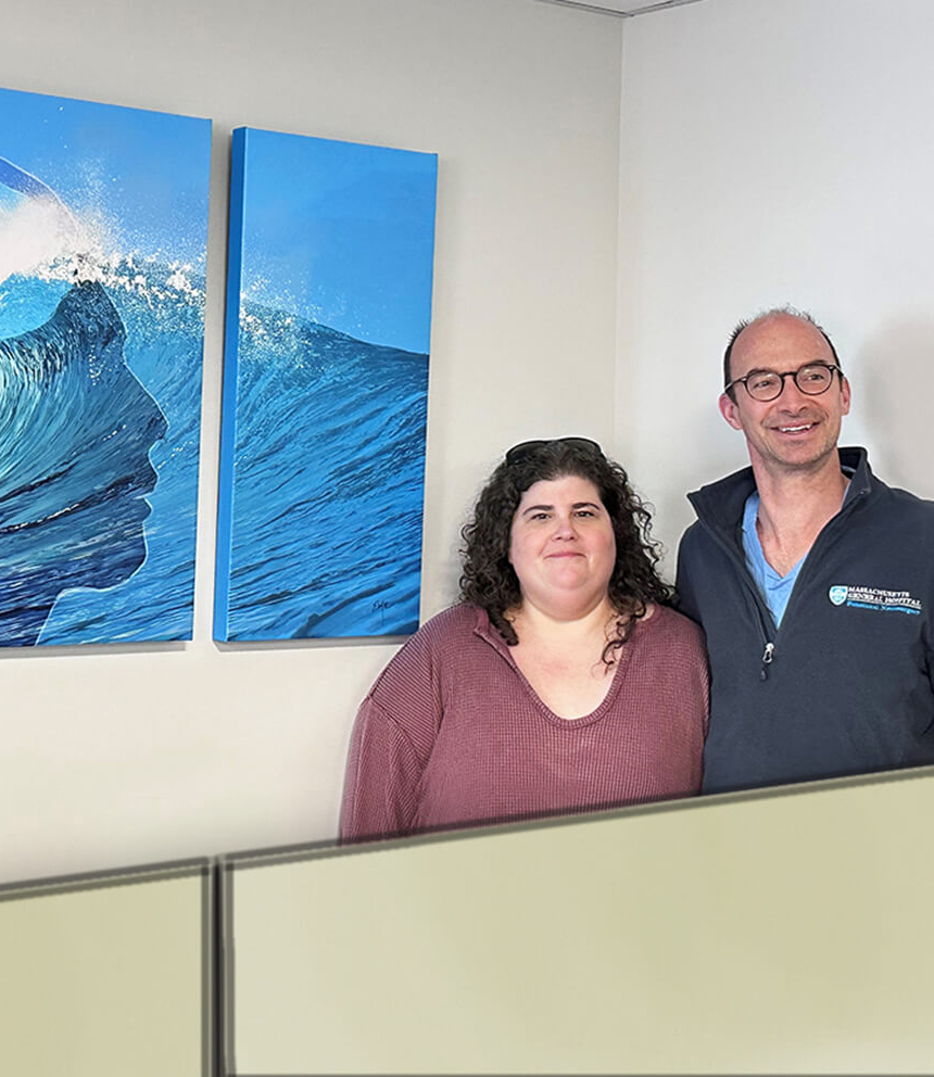 Emily Kalina and Mark Richardson, MD, PhD, standing beside a commissioned installation by Emily.