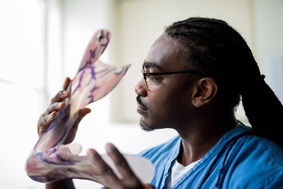 Nurse studying orthopedic model