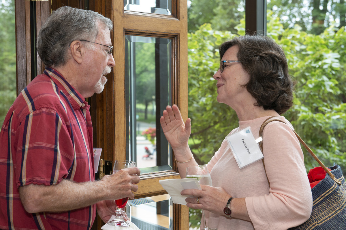 Two people talking in a doorway