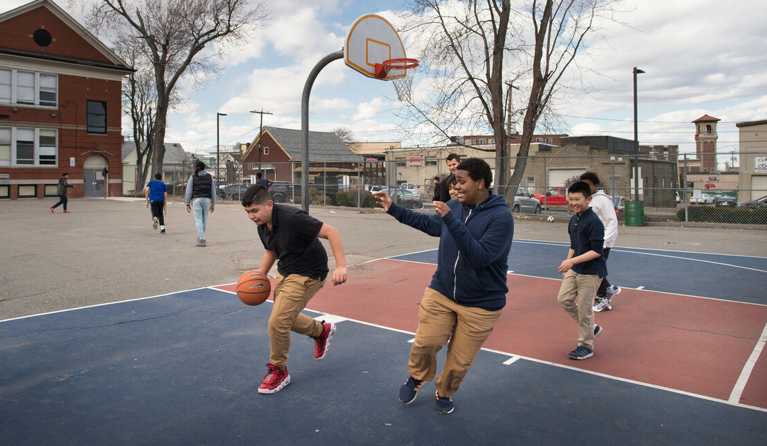 Boys playing basketball