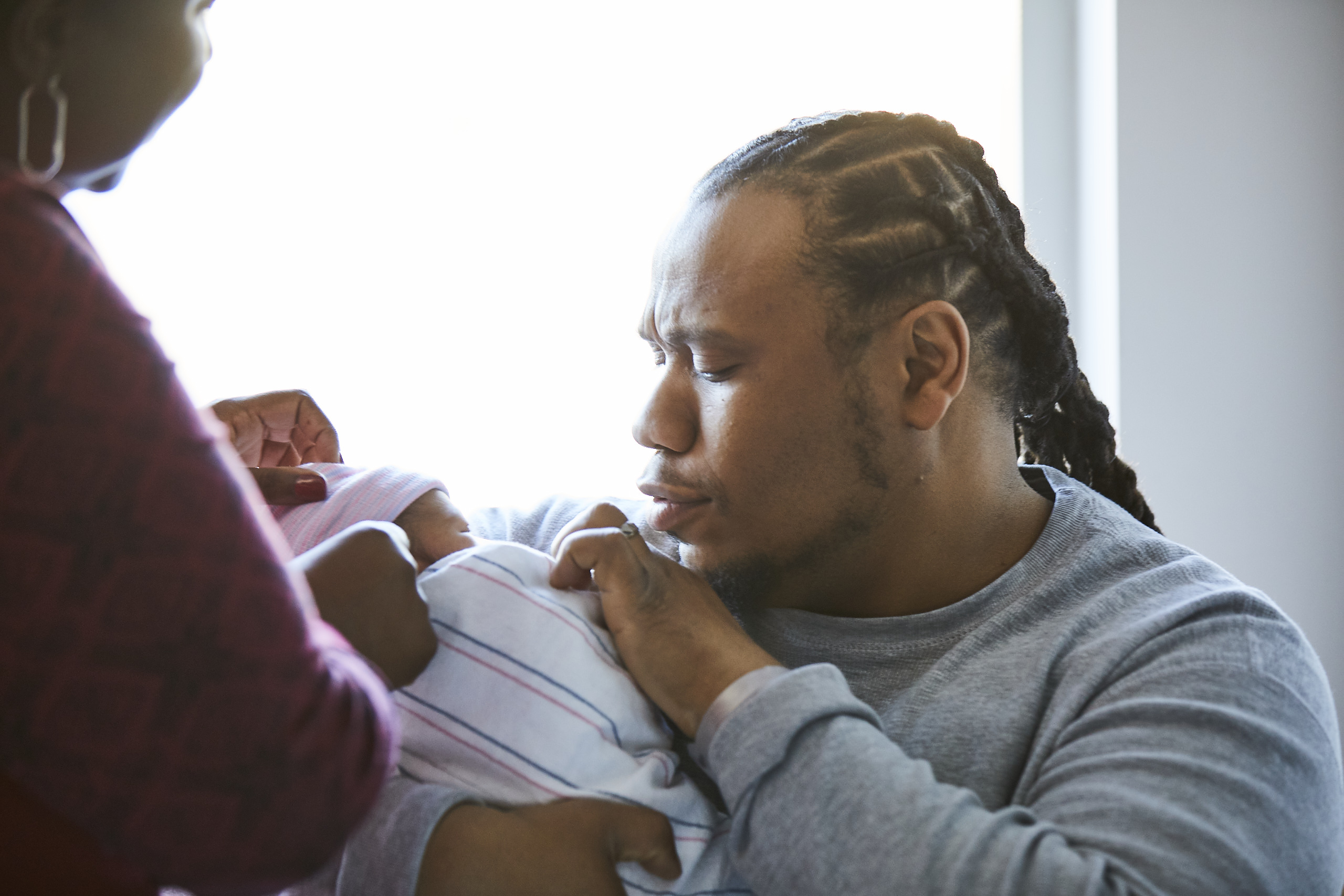 Father holding newborn baby in Mass General's OBGYN Labor and Delivery unit