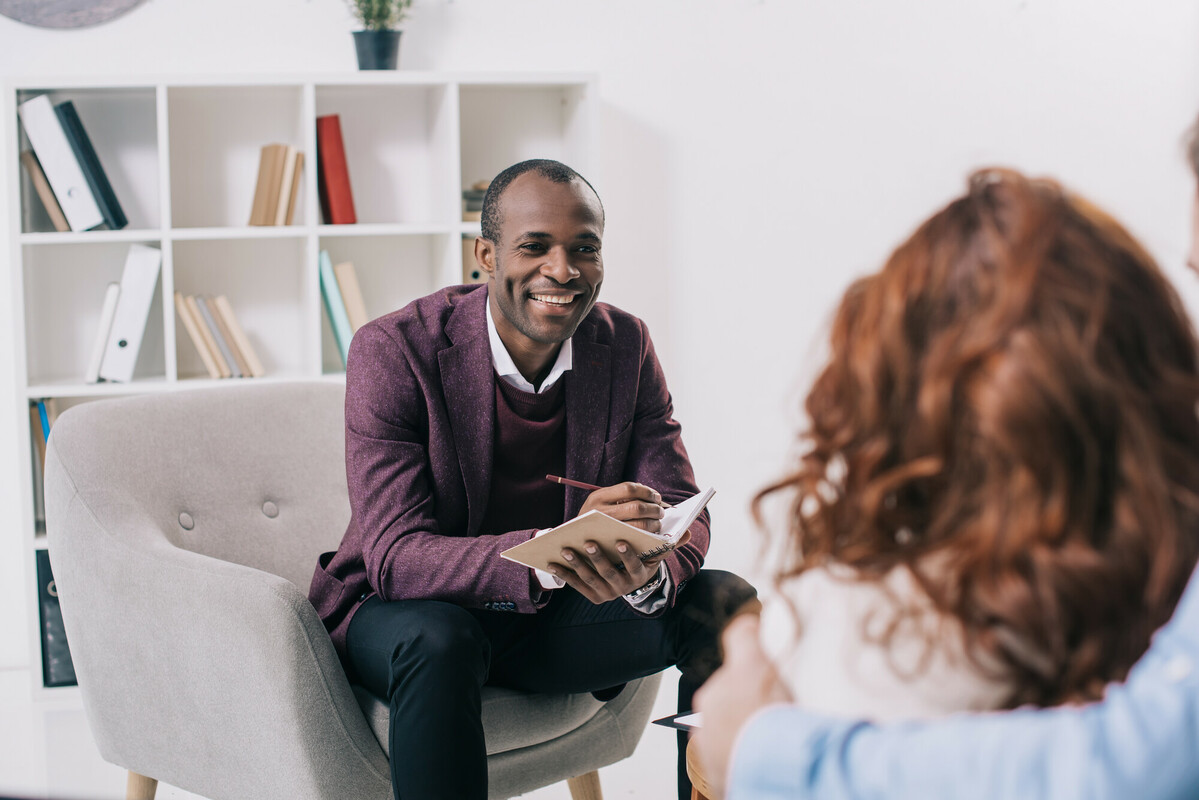 Patient meets with a psychiatrist who takes notes