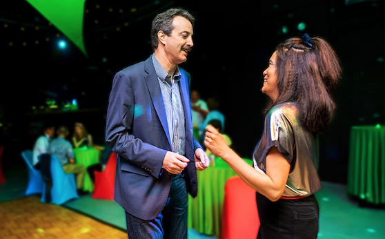 Two people talking at a fundraiser