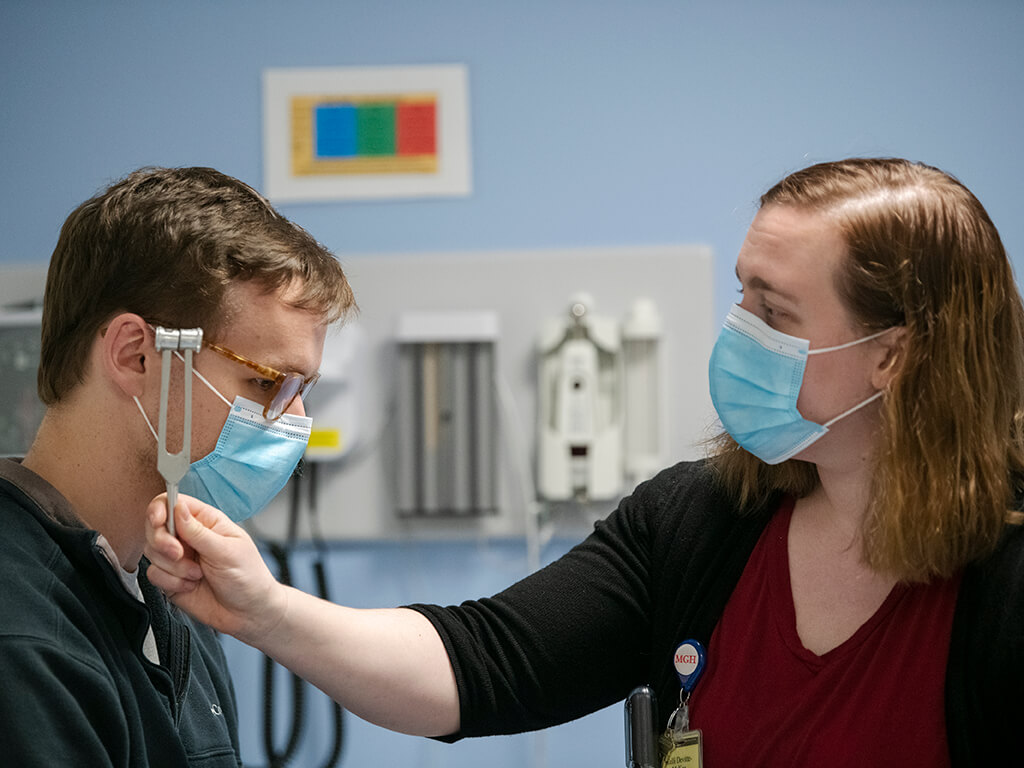 Doctor and patient with instrument